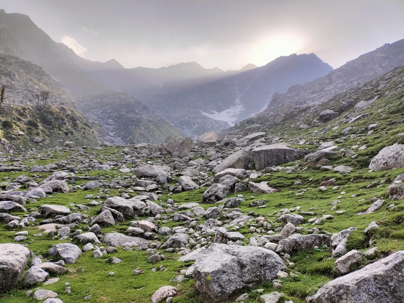 Boulder-strewn alpine valley leading up to the Dhauladhar peaks near Laka Glacier